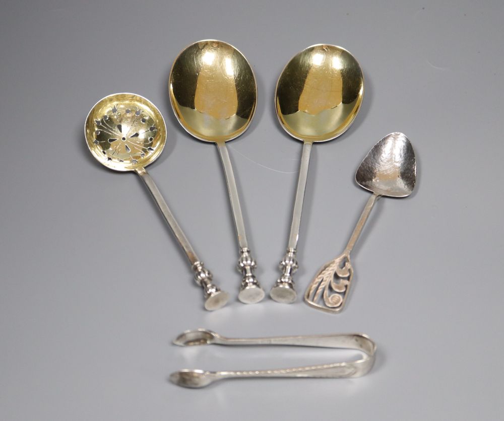 A pair of George V silver seal top serving spoons by Mappin & Webb, a silver sifter spoon, pair of silver tongs etc.